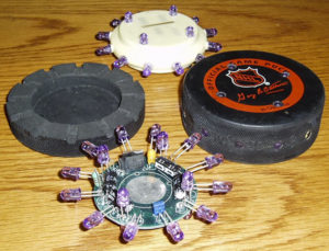 The innards of a glowing puck.